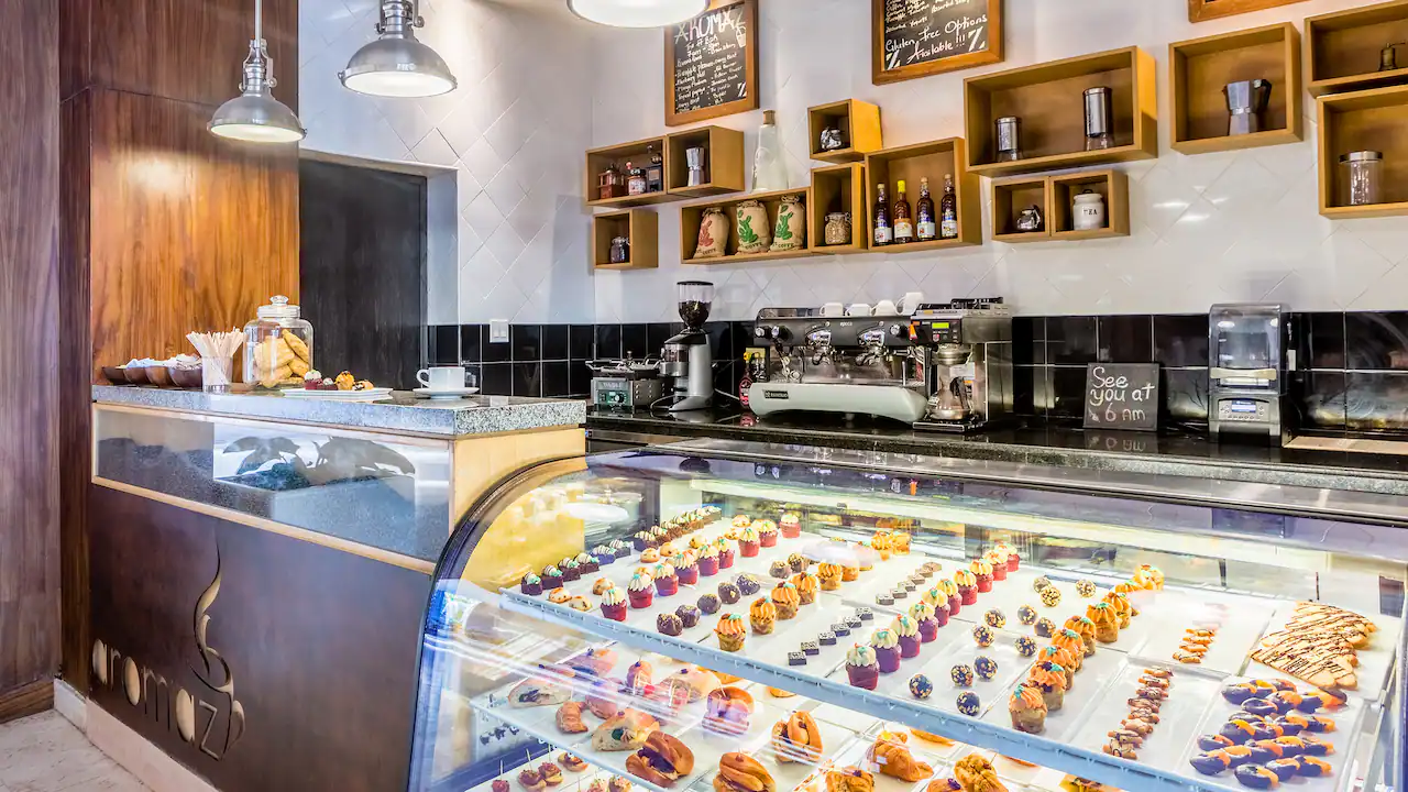 Aromaz coffee shop at Hyatt Zilara Rose Hall featuring freshly brewed coffee, gourmet pastries, and a cozy café atmosphere.