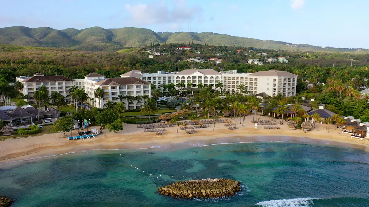 Panoramic aerial view of Hyatt Zilara Rose Hall with private beach, crystal-clear Caribbean waters, and lush tropical surroundings.