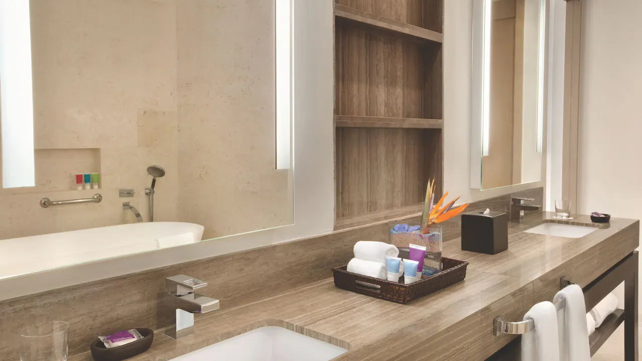 Modern bathroom vanity and soaking tub in the Grand Butler Suite at Hyatt Zilara Rose Hall.