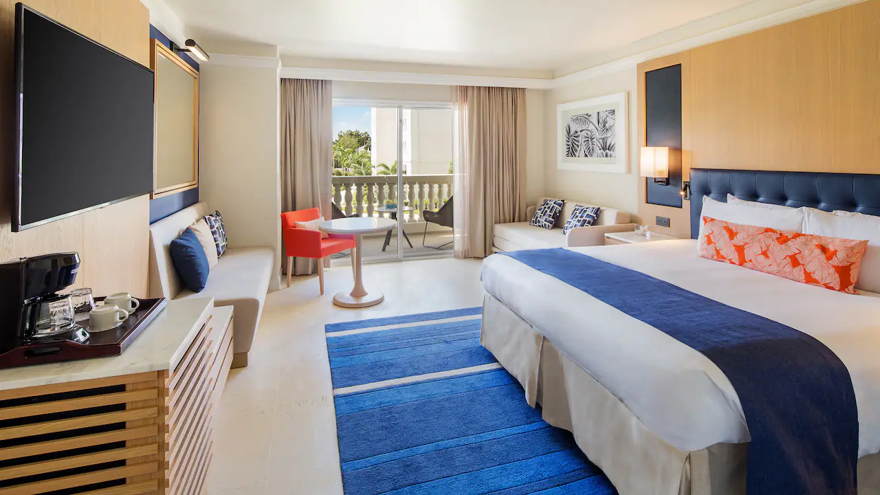 King room with plush king bed and furnished terrace at Hyatt Zilara Rose Hall.