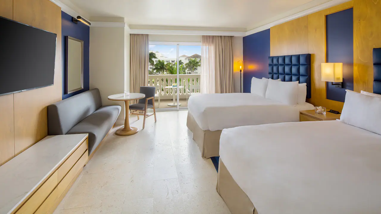 Ocean View Double room with two queen beds and furnished balcony at Hyatt Zilara Rose Hall.