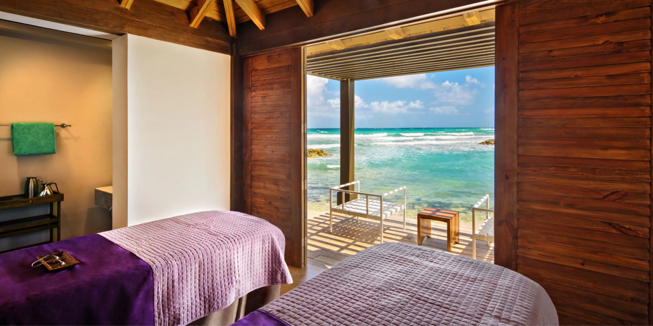 Oceanfront spa treatment room with massage tables overlooking the Caribbean Sea at Hyatt Zilara Rose Hall.