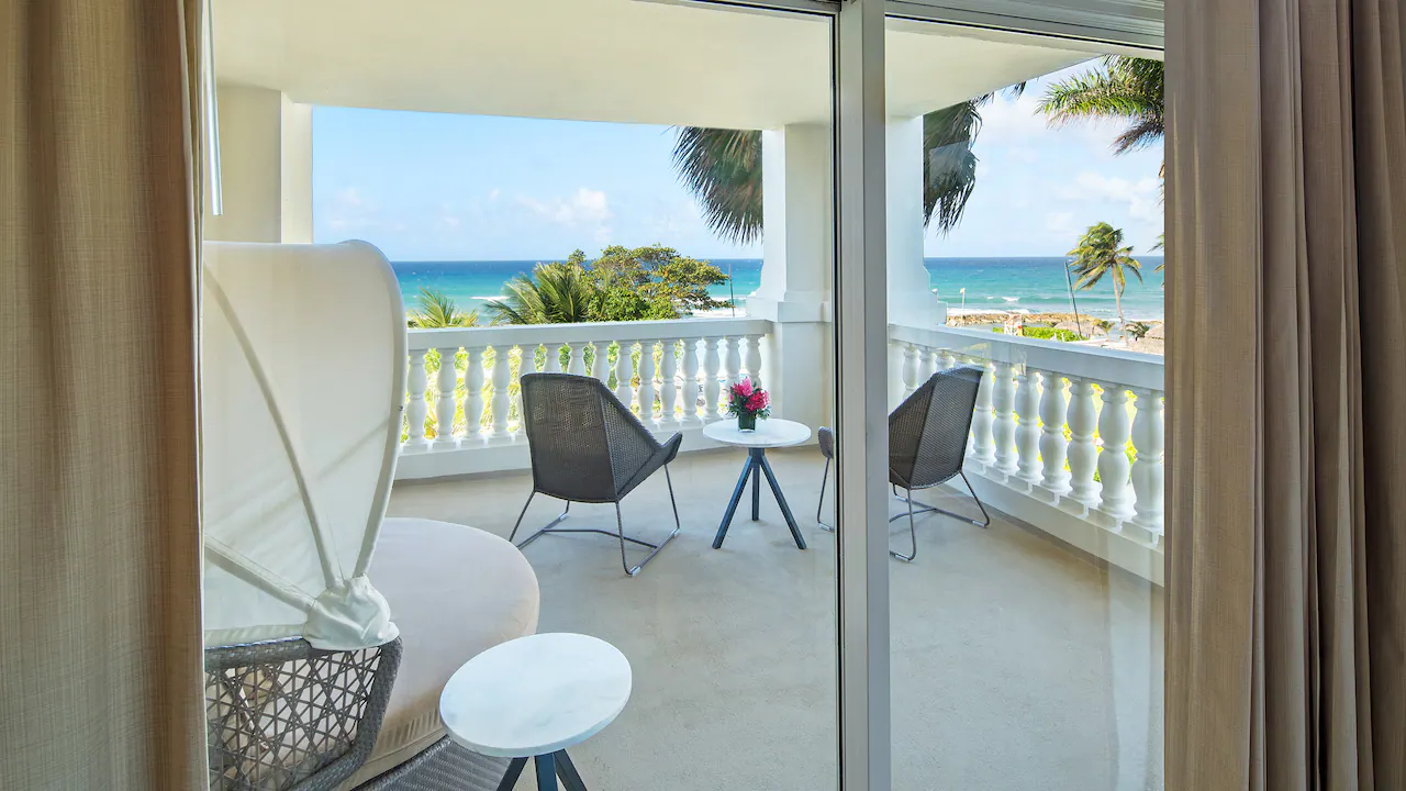 Private balcony with Caribbean Sea views from the One Bedroom Ocean View Suite at Hyatt Zilara Rose Hall.
