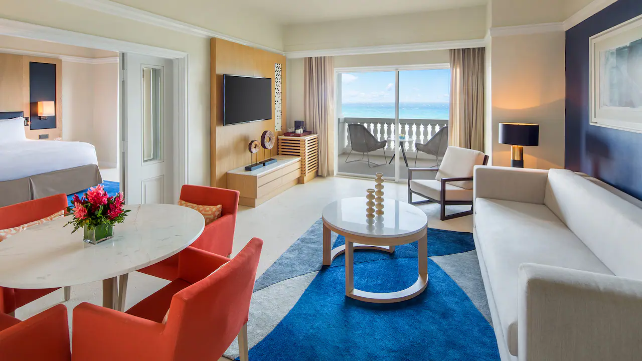 Living room with sleeper sofa in the One Bedroom Oceanfront Butler Suite at Hyatt Zilara Rose Hall.