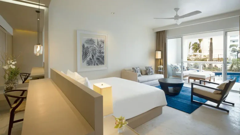 Swim-Up Junior Suite King bedroom with pool-view terrace at Hyatt Zilara Rose Hall.